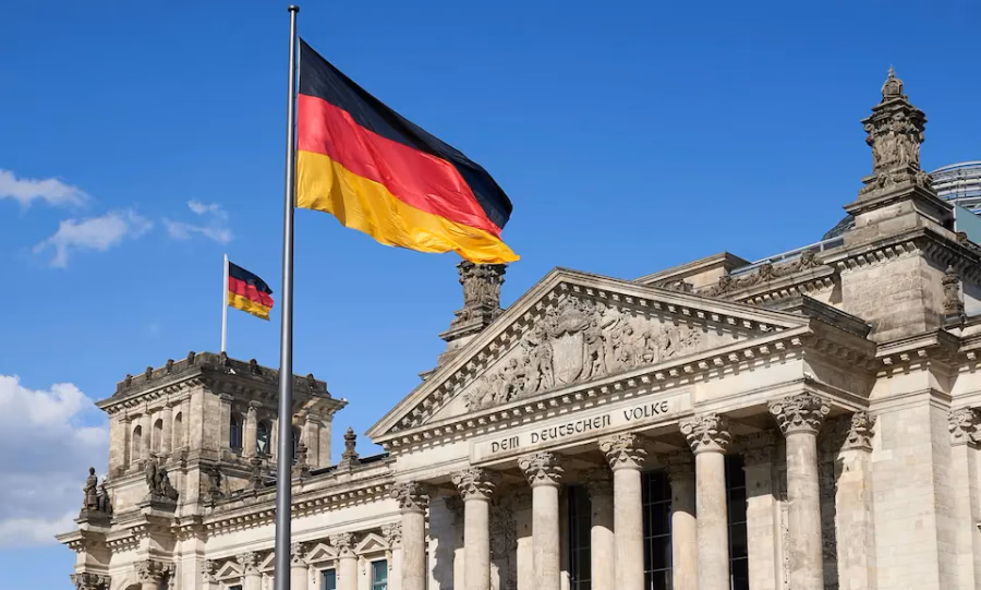 Reichstag building with German flag — leave Germany tax residency guide