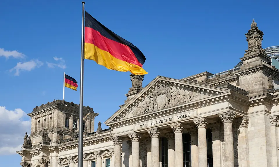 Reichstag building with German flag — leave Germany tax residency guide