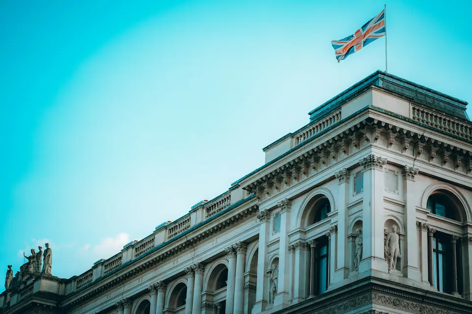 London building with Union Jack — leave UK tax residency guide