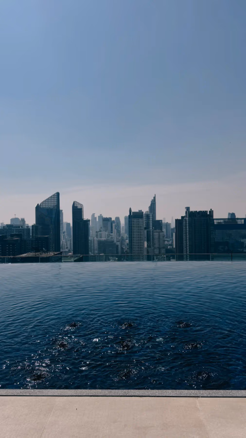 Rooftop infinity pool with Bangkok skyline