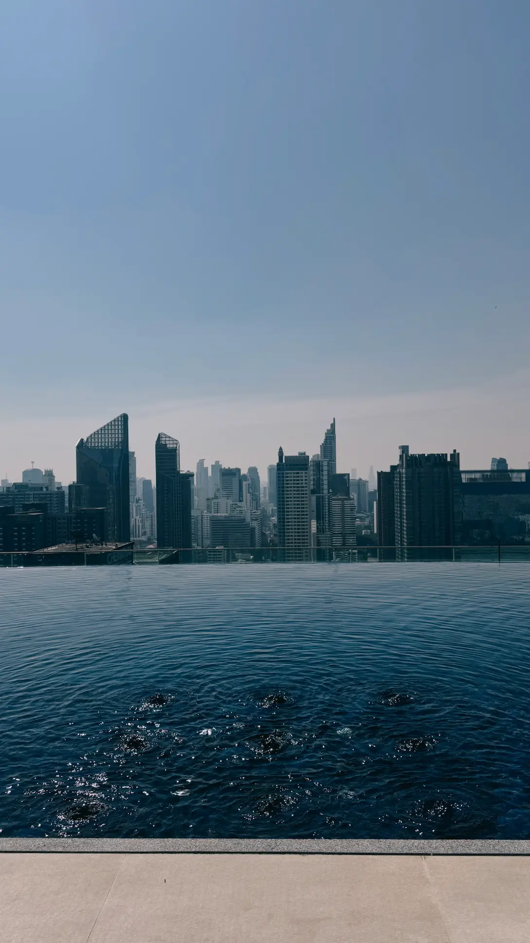 Rooftop infinity pool with Bangkok skyline