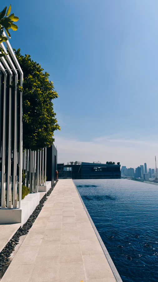 Rooftop pool walkway with Bangkok skyline